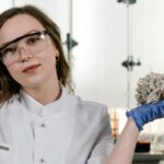 citizen scientist collecting scat sample