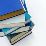 stack of books with lightbulb